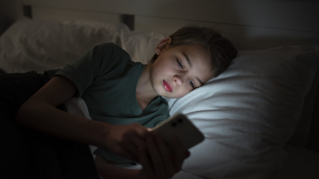 child sleeping with phone
